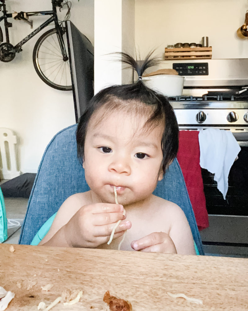 Baby eating noodles