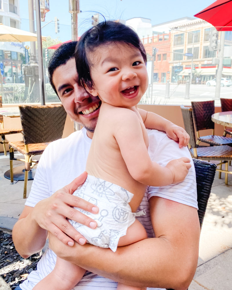 Lucas smiling at camera with dad