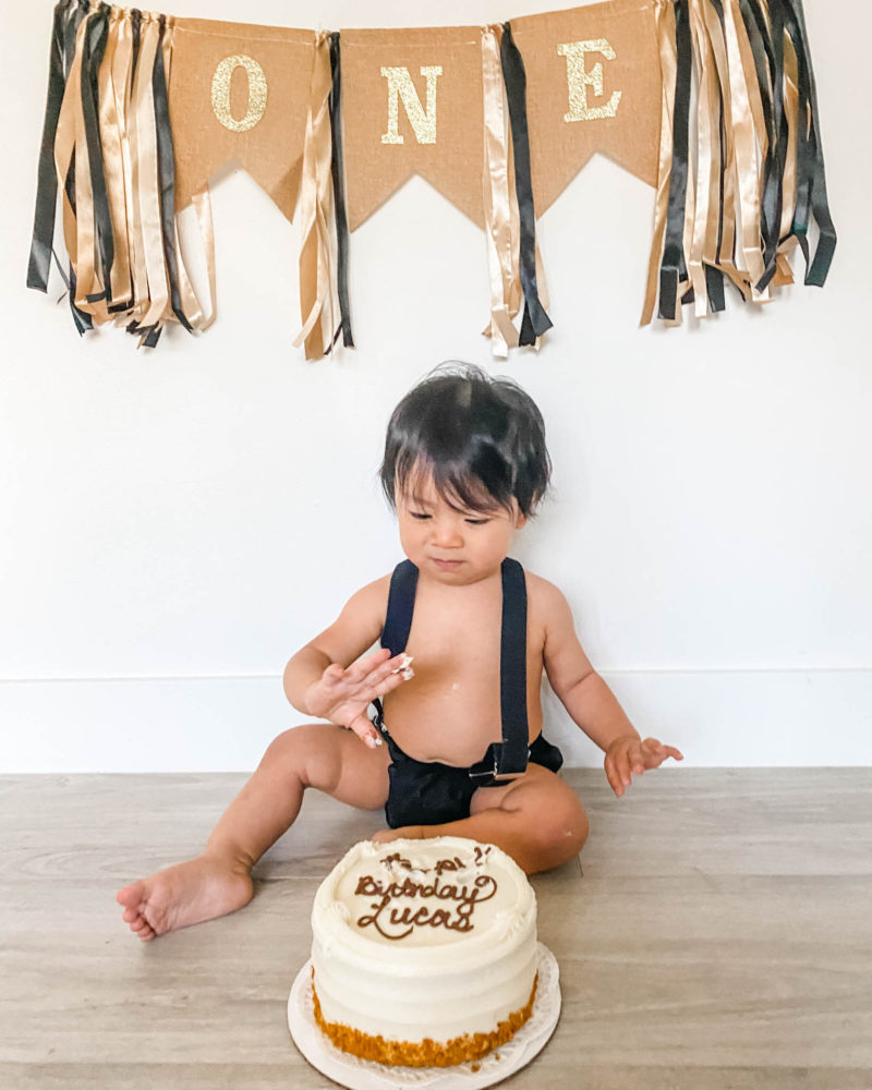 Baby with his one year old cake