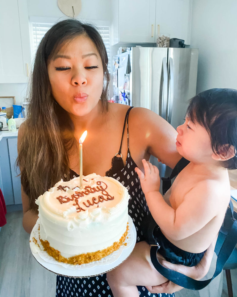 mom blowing candle for baby